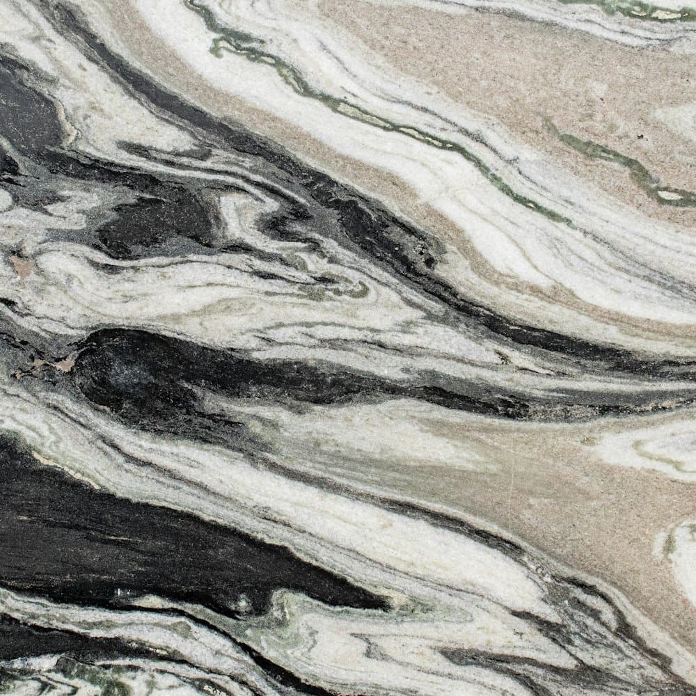 Swirled granite swatch in cream, grey, green and black
