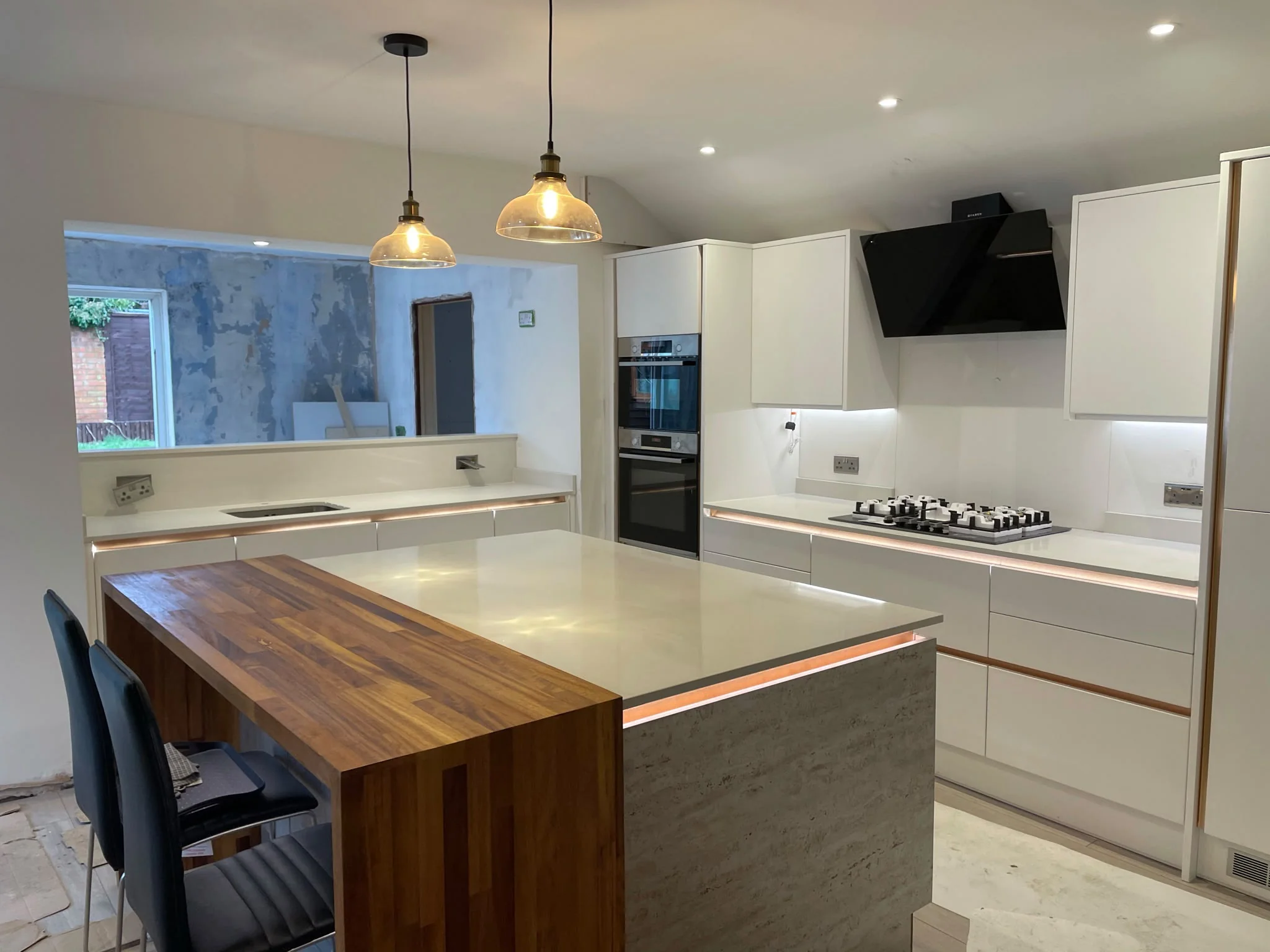 Light Grey Quartz: quartz island beside a timber breakfast bar